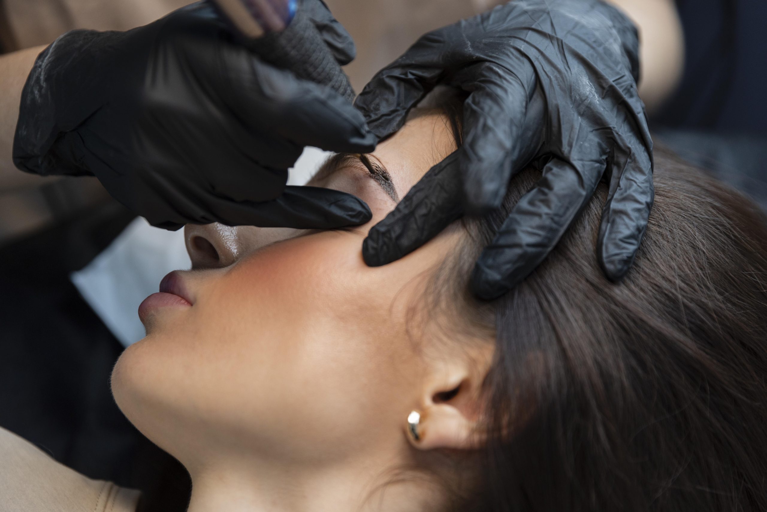 young-woman-getting-beauty-tcreatment-for-her-eyebrows