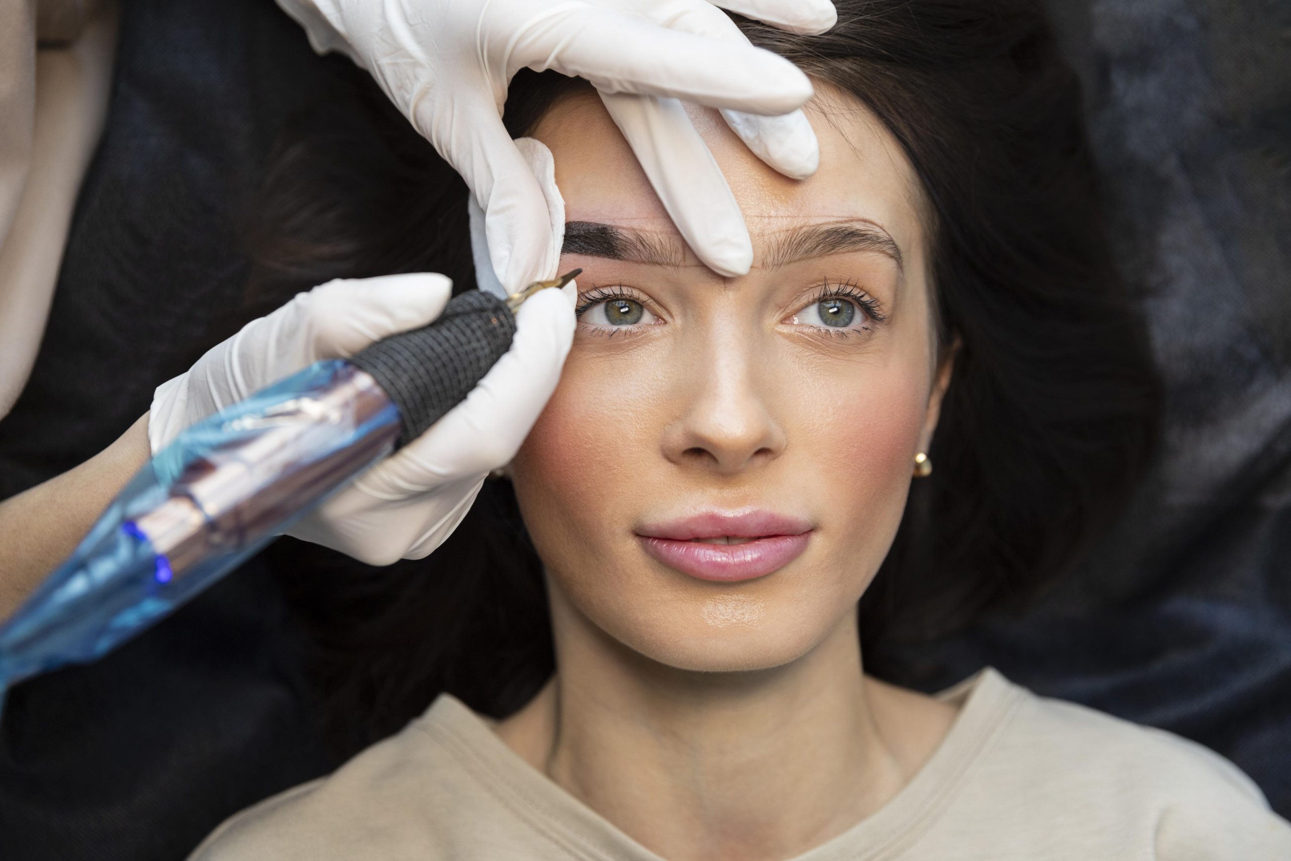 young-woman-getting-beauty-treatment-for-her-eyebrows